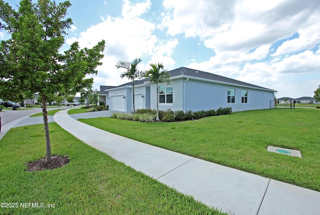 view of home's exterior featuring driveway, an attached garage, a yard, and stucco siding