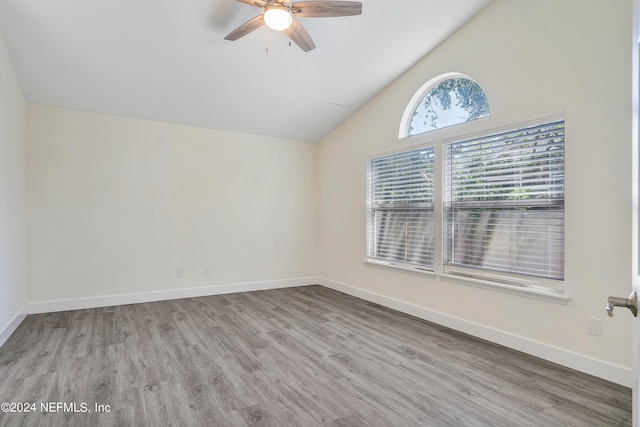 bonus room with ceiling fan, wood finished floors, baseboards, and high vaulted ceiling