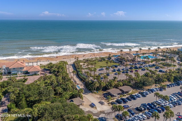 aerial view of property and surrounding area featuring extended coastline