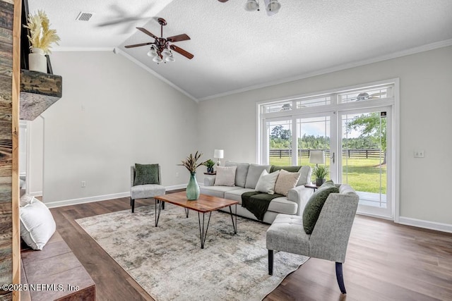 27359 Geiger Rd, Hilliard, FL 32046 - living area with a ceiling fan, wood finished floors, ornamental molding, a textured ceiling, and vaulted ceiling