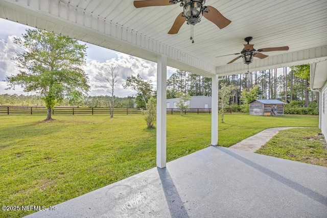 27359 Geiger Rd, Hilliard, FL 32046 - view of yard with a patio area, a ceiling fan, an outdoor structure, and a view of rural / pastoral area