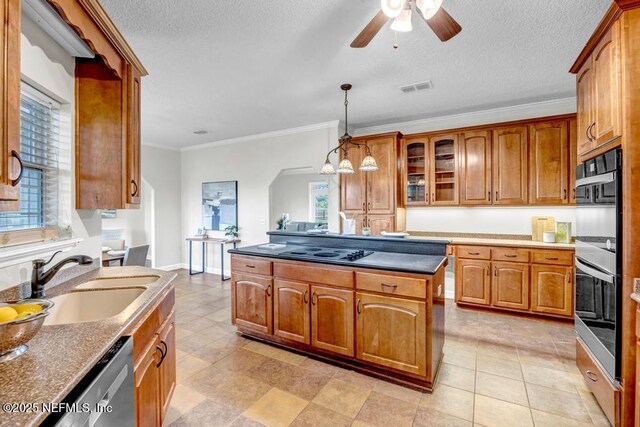 27359 Geiger Rd, Hilliard, FL 32046 - kitchen with a sink, stainless steel appliances, ceiling fan, ornamental molding, and brown cabinets