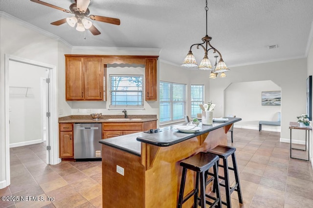 27359 Geiger Rd, Hilliard, FL 32046 - kitchen with dishwasher, a kitchen bar, crown molding, a kitchen island, and a sink