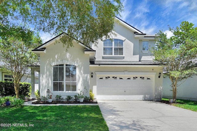 767 Mosswood Chase St, Orange Park, FL 32065 - traditional-style house with stucco siding, a garage, concrete driveway, and a front yard