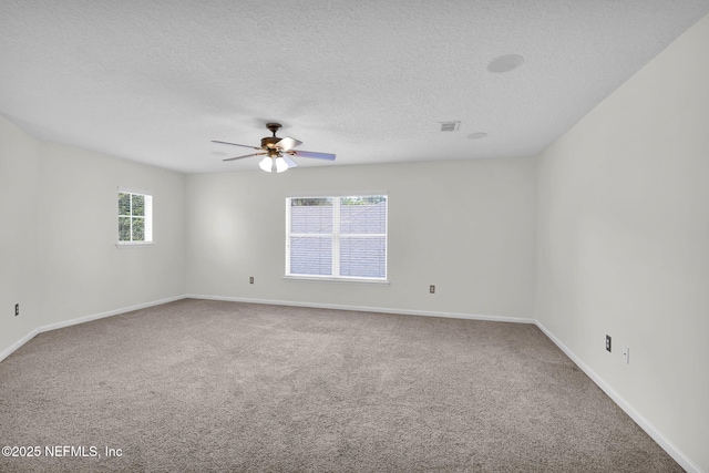 767 Mosswood Chase St, Orange Park, FL 32065 - unfurnished room with carpet, ceiling fan, a textured ceiling, and baseboards