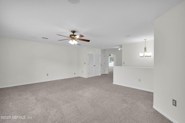 767 Mosswood Chase St, Orange Park, FL 32065 - empty room featuring a chandelier, carpet floors, a ceiling fan, and baseboards