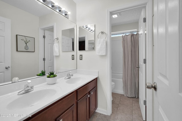 767 Mosswood Chase St, Orange Park, FL 32065 - bathroom featuring double vanity, toilet, tile patterned flooring, shower / tub combo with curtain, and a textured ceiling