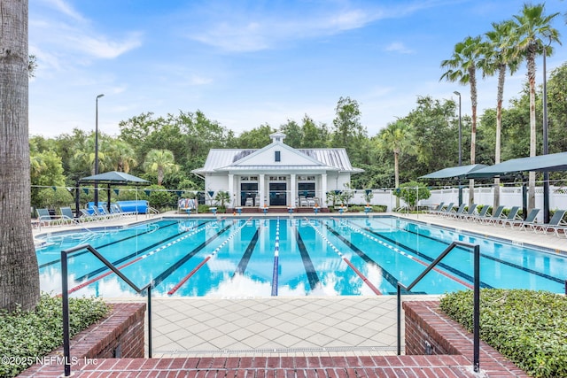 767 Mosswood Chase St, Orange Park, FL 32065 - community pool featuring fence, a patio, and view of scattered trees