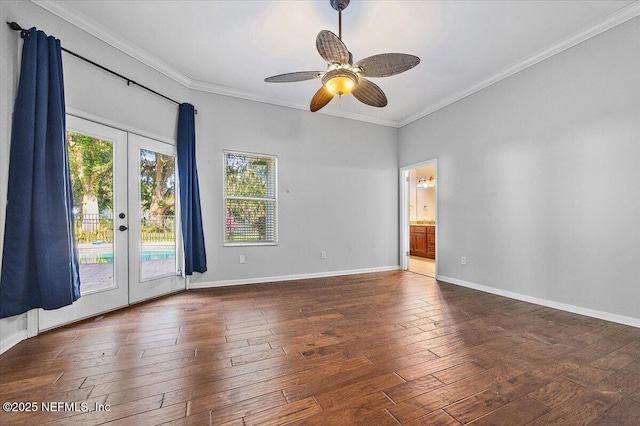 empty room with plenty of natural light, french doors, hardwood / wood-style flooring, crown molding, and ceiling fan