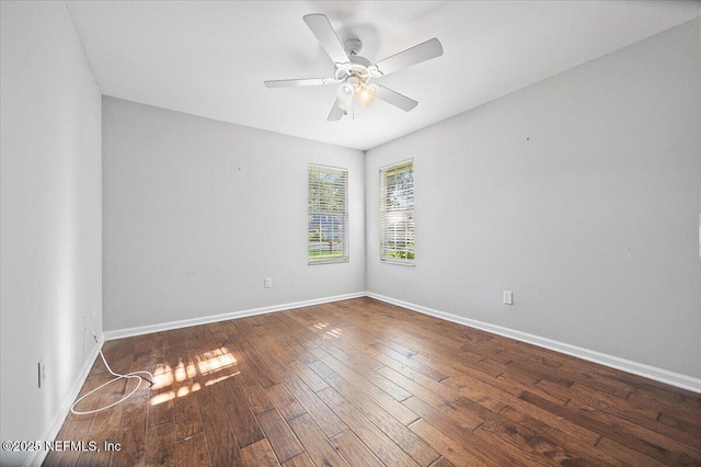 empty room with hardwood / wood-style flooring, baseboards, and a ceiling fan