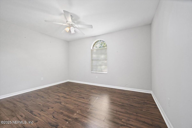 unfurnished room with wood finished floors, ceiling fan, and baseboards