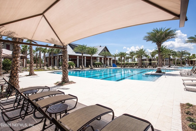 community pool with a patio area