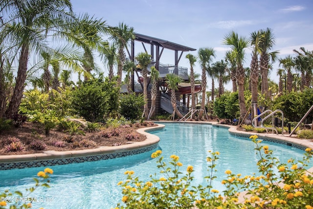 community pool featuring stairs