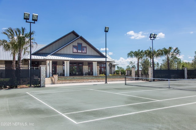 view of tennis court with fence
