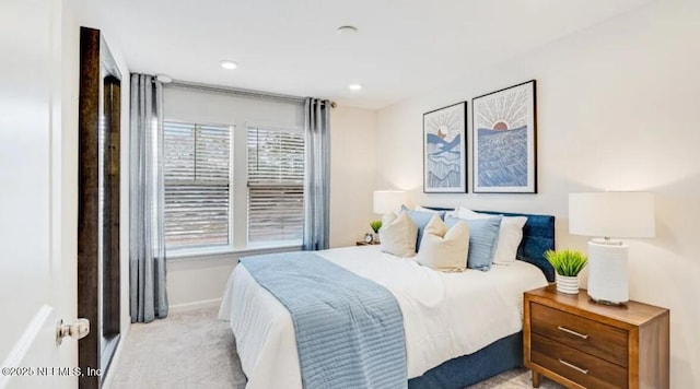 carpeted bedroom with baseboards and recessed lighting