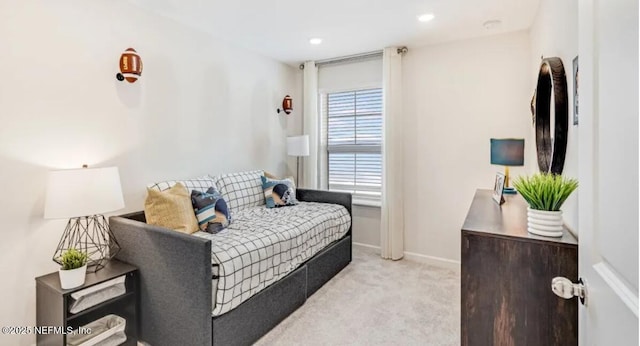 living room with light colored carpet, baseboards, and recessed lighting