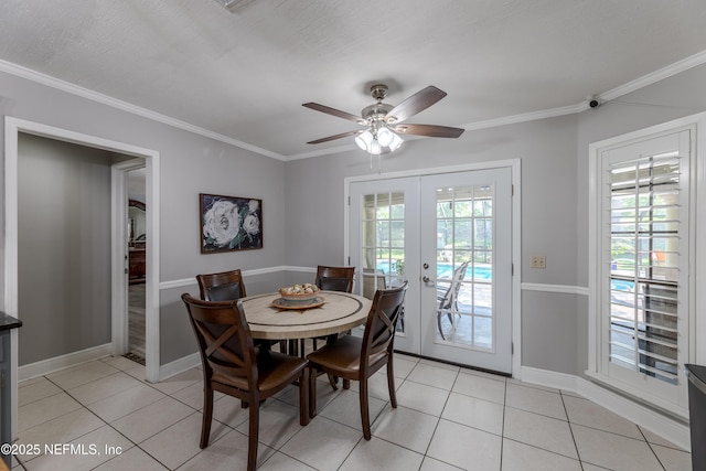 806 Falkirk Ct, Orange Park, FL 32073 - dining space with french doors, healthy amount of natural light, light tile patterned floors, and crown molding