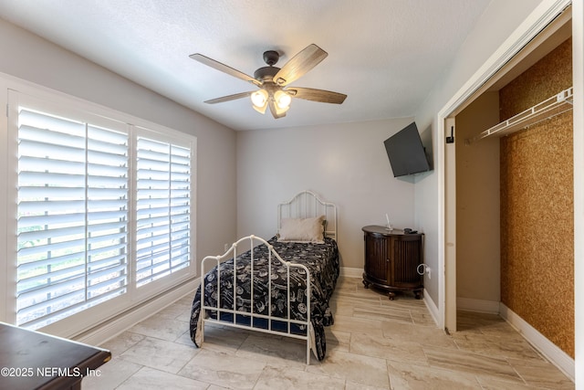 806 Falkirk Ct, Orange Park, FL 32073 - bedroom with baseboards and a ceiling fan