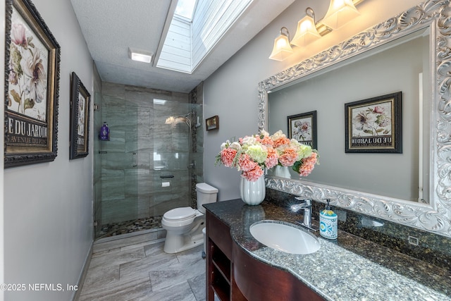 806 Falkirk Ct, Orange Park, FL 32073 - full bathroom featuring a skylight, a stall shower, toilet, and vanity