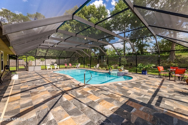 806 Falkirk Ct, Orange Park, FL 32073 - view of pool featuring a patio area, a pool with connected hot tub, a fenced backyard, and glass enclosure