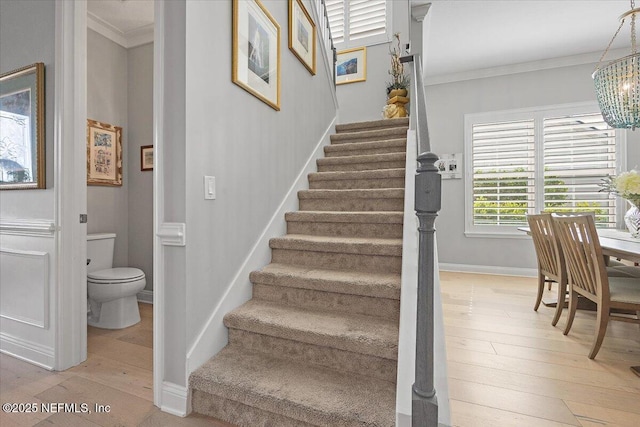 433 Marsh Cove Dr, Ponte Vedra Beach, FL 32082 - stairs with hardwood / wood-style floors, crown molding, and a chandelier