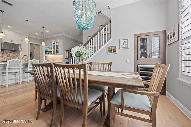 433 Marsh Cove Dr, Ponte Vedra Beach, FL 32082 - dining room featuring light wood-type flooring, a chandelier, recessed lighting, ornamental molding, and baseboards