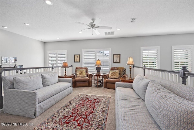 433 Marsh Cove Dr, Ponte Vedra Beach, FL 32082 - living room featuring light carpet, a ceiling fan, healthy amount of natural light, recessed lighting, and a textured ceiling