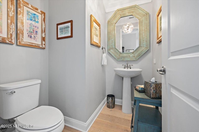 433 Marsh Cove Dr, Ponte Vedra Beach, FL 32082 - half bath featuring toilet, wood finished floors, baseboards, and a sink