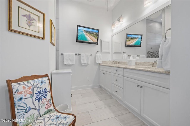 433 Marsh Cove Dr, Ponte Vedra Beach, FL 32082 - bathroom with double vanity, baseboards, and a tile shower