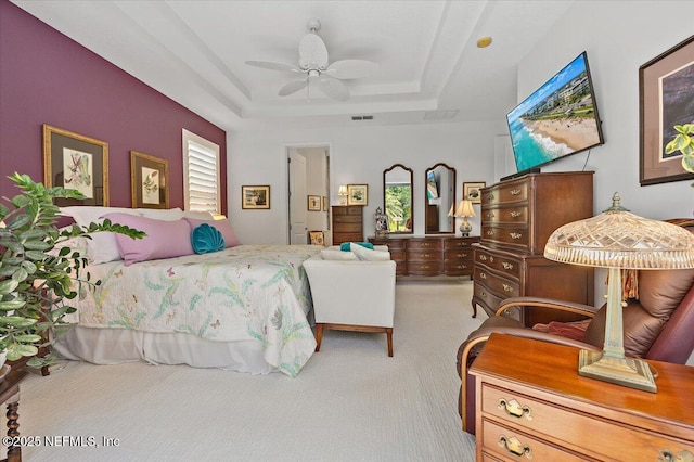 433 Marsh Cove Dr, Ponte Vedra Beach, FL 32082 - bedroom with light colored carpet, a tray ceiling, and a ceiling fan