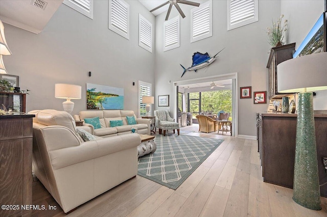 433 Marsh Cove Dr, Ponte Vedra Beach, FL 32082 - living area featuring ceiling fan, a high ceiling, hardwood / wood-style flooring, and baseboards