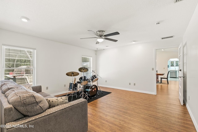120 Stokes Landing Rd, Saint Augustine, FL 32095 - living area with light wood-style floors, plenty of natural light, ceiling fan, and baseboards