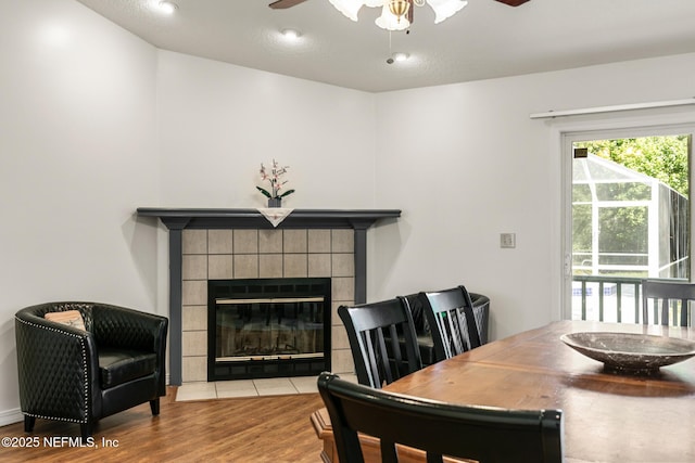 120 Stokes Landing Rd, Saint Augustine, FL 32095 - dining room featuring ceiling fan, wood finished floors, and a fireplace