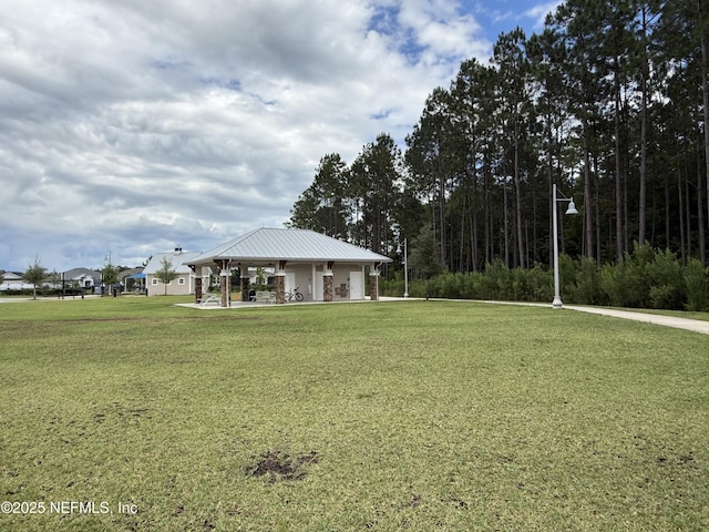 surrounding community featuring a gazebo and a lawn
