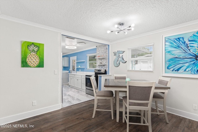 dining room featuring a chandelier, wood finished floors, ornamental molding, a textured ceiling, and baseboards