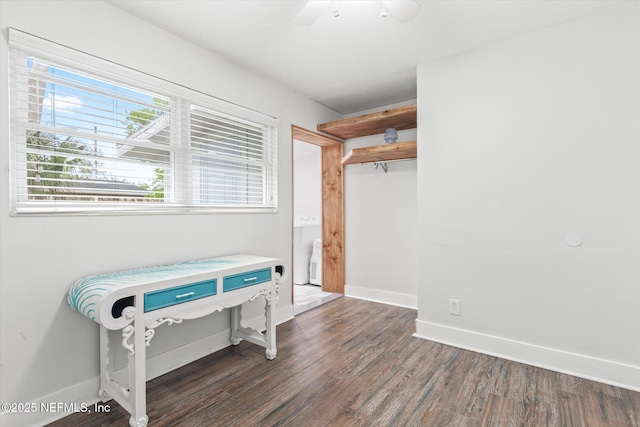 bedroom featuring baseboards, dark wood-style flooring, and ceiling fan