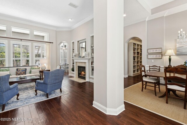 724 Piney Pl, Saint Johns, FL 32259 - living room with arched walkways, wood-type flooring, crown molding, a fireplace with flush hearth, and recessed lighting