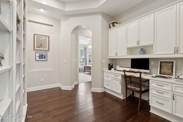 724 Piney Pl, Saint Johns, FL 32259 - office space featuring built in study area, dark wood finished floors, arched walkways, ceiling fan, and baseboards