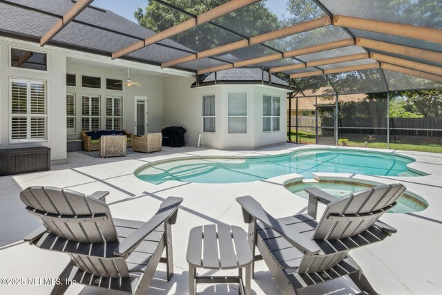 724 Piney Pl, Saint Johns, FL 32259 - view of swimming pool featuring a patio area, a ceiling fan, a pool with connected hot tub, fence, and glass enclosure