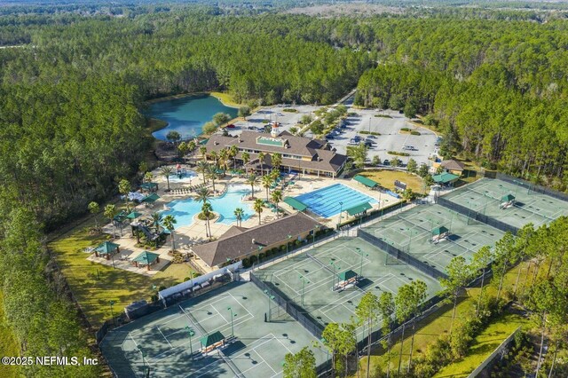 724 Piney Pl, Saint Johns, FL 32259 - drone / aerial view of a forest, a pool area, and a nearby body of water