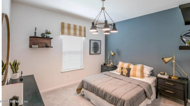 374 Higgins Loop, Saint Augustine, FL 32092 - bedroom with carpet flooring, a chandelier, and baseboards