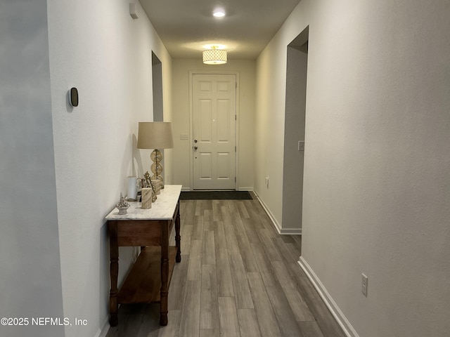 10470 Collins Field Cir, Jacksonville, FL 32222 - hall with dark wood-style floors and baseboards