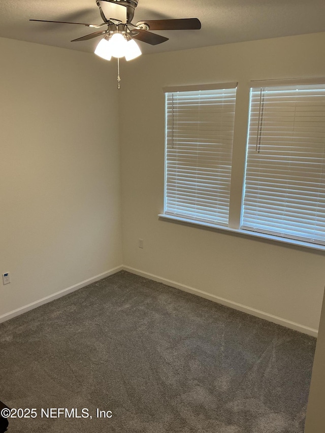 10470 Collins Field Cir, Jacksonville, FL 32222 - empty room with dark colored carpet, ceiling fan, and baseboards