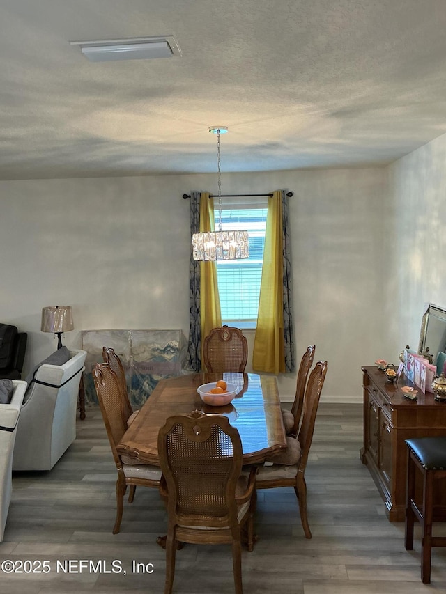 10470 Collins Field Cir, Jacksonville, FL 32222 - dining space featuring wood finished floors and a chandelier