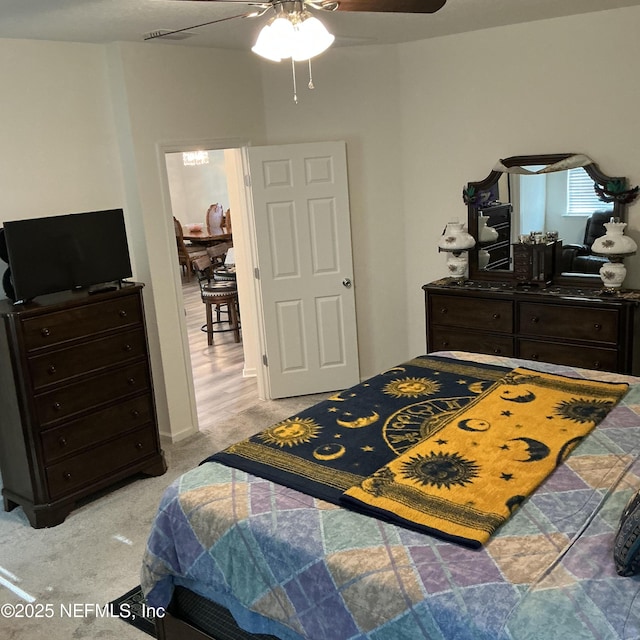 10470 Collins Field Cir, Jacksonville, FL 32222 - bedroom with light carpet and a ceiling fan