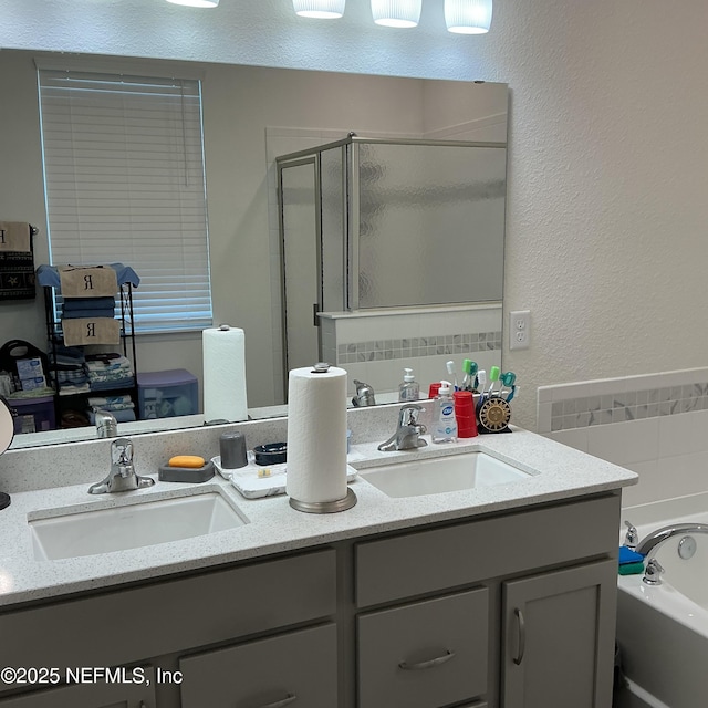 10470 Collins Field Cir, Jacksonville, FL 32222 - full bath featuring a shower stall, a garden tub, double vanity, and a textured wall