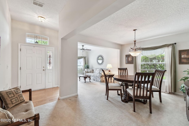 324 Hammock Grove Ct, Saint Johns, FL 32259 - dining space with a textured ceiling, light carpet, and baseboards