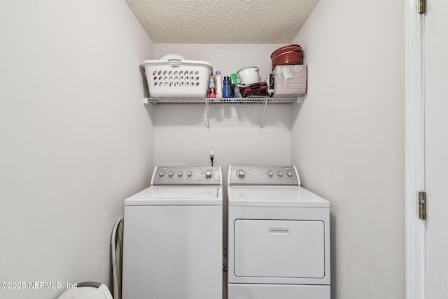 324 Hammock Grove Ct, Saint Johns, FL 32259 - laundry room with washer and dryer and a textured ceiling