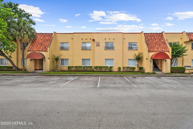 6552 La Mirada Dr E Unit 7, Jacksonville, FL 32217 - view of building exterior featuring uncovered parking