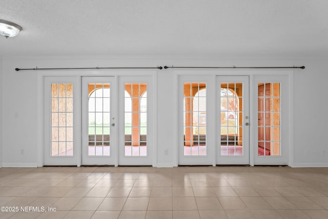 6552 La Mirada Dr E Unit 7, Jacksonville, FL 32217 - doorway with ornamental molding, baseboards, and healthy amount of natural light
